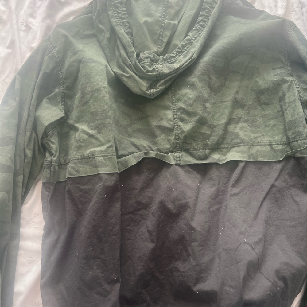 Camo jacket bottom half is dark gray